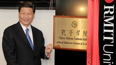 China's Vice President Xi Jinping unveils the plaque at the opening of Australia's first Chinese Medicine Confucius Institute at the RMIT University in Melbourne on June 20, 2010. 