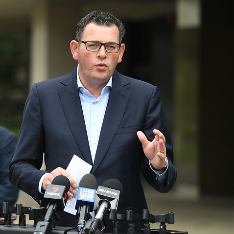 Victorian Premier Daniel Andrews and Victorian Treasurer Tim Pallas speak to the media during a press conference in Melbourne, Saturday, March 21, 2020. (AAP Image/Erik Anderson) NO ARCHIVING