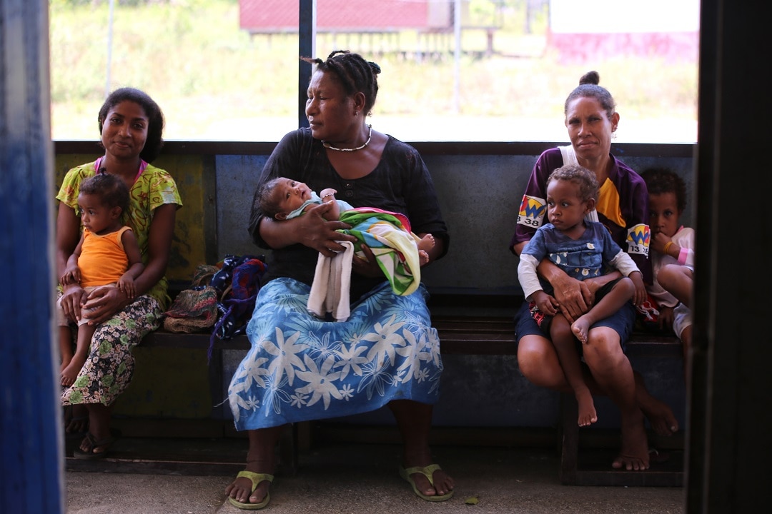 Women and their children at a health clinic in PNG. 