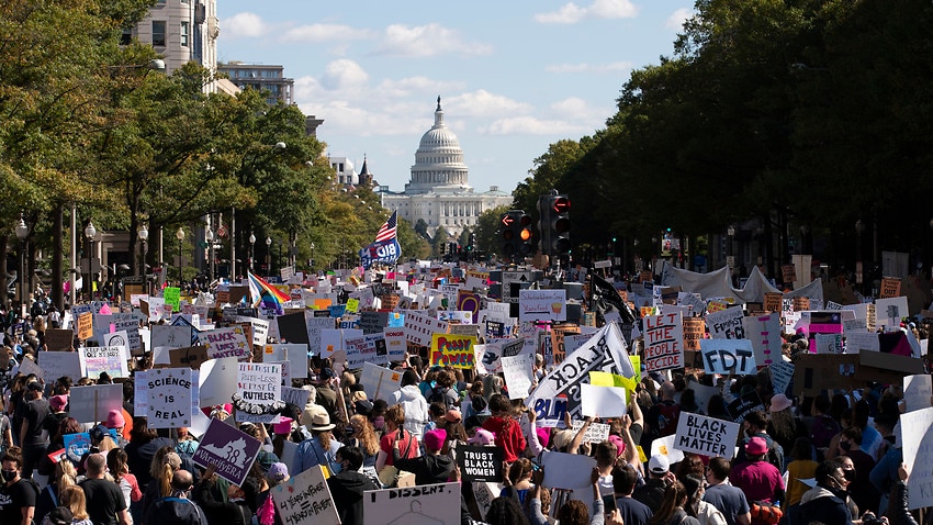 EDS NOTE: OBSCENITY - With the U.S Capitol in the back ground demonstrators march on Pennsylvania Avenue during the Women's March in Washington, Saturday, Oct. 17, 2020. (AP Photo/Jose Luis Magana)