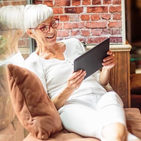 Senior woman with digital tablet