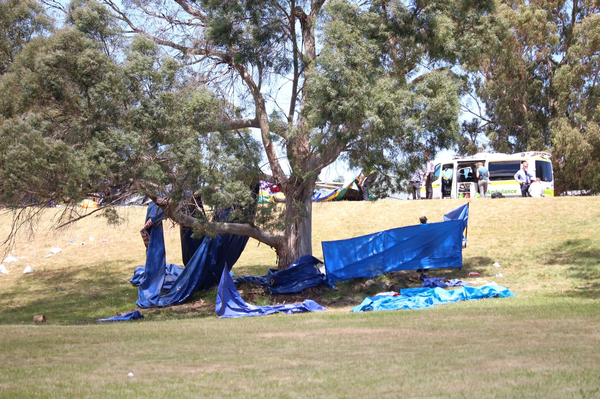 One child was killed and others critically injured after jumping castle was blown into air in Tasmania