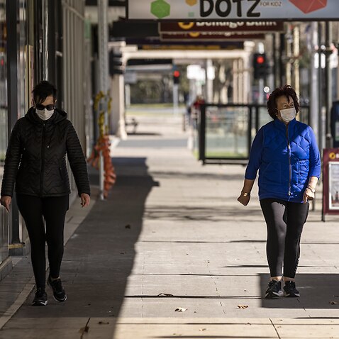 People are seen walking in Shepparton, Victoria, where lockdowns remain.