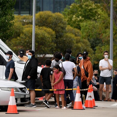 Long queues are seen as people wait to recieve a Covid test at a drive through and walk up testing facility at Macquarie Park, in Sydney, Wednesday, December 22, 2021. (AAP Image/Dan Himbrechts) NO ARCHIVING