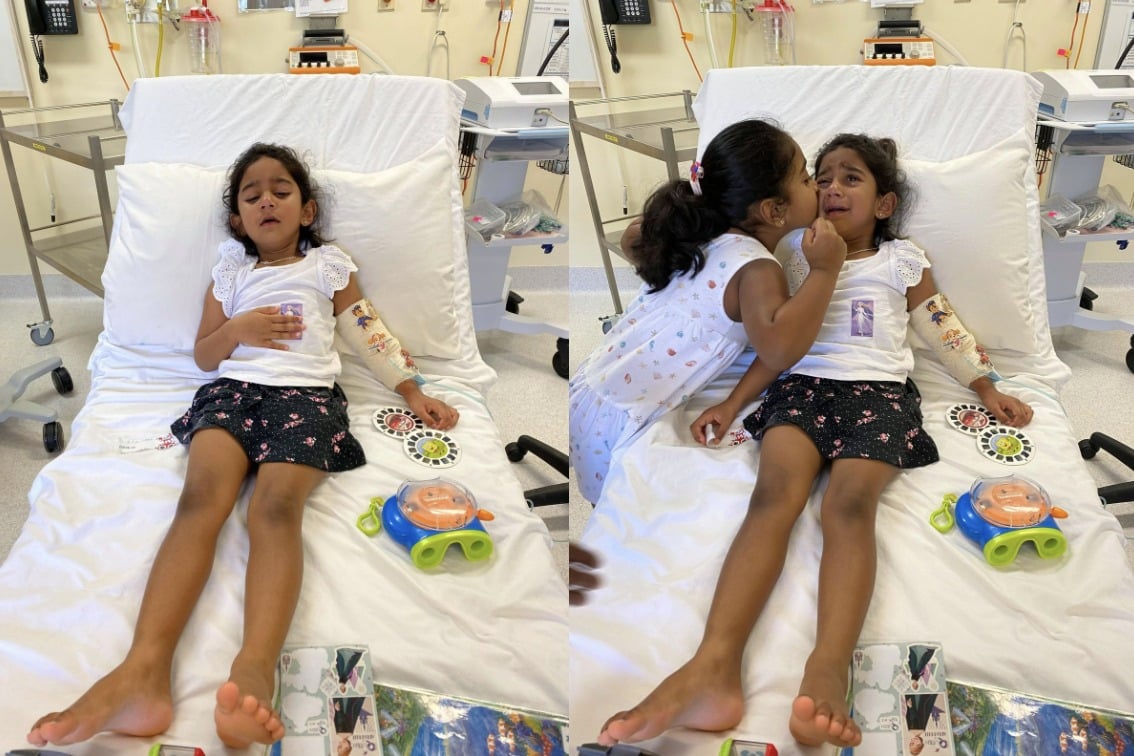 Tharnicaa and her older sister Kopika in hospital on Christmas Island before her medical evacuation.