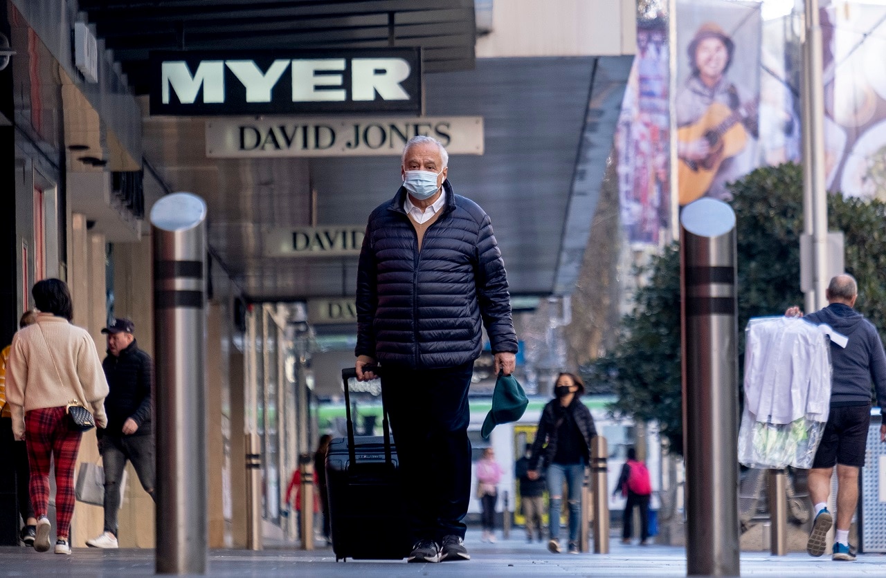 People wear masks in Melbourne on Thursday.