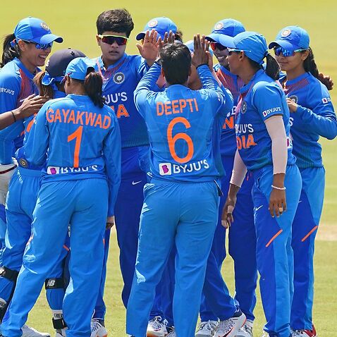 Arundhati Reddy of India is congratulated by her teammates 