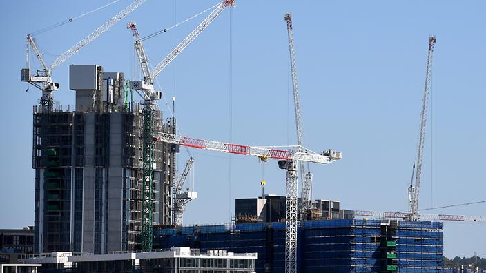 An unexpected leap in apartment approvals intensifies risks in the housing market, analysts warn. (AAP)