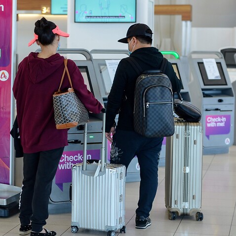 Travellers at self-check-in machines at  Adelaide Airport in Adelaide. (file)