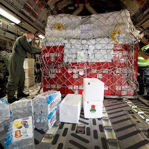 A pallet of Australian Aid bound for Tonga being secured in a C-17A Globemaster in January