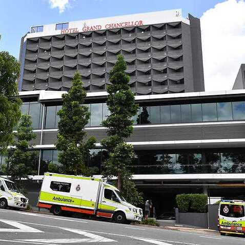 Ambulances are seen lined up outside the Hotel Grand Chancellor in Brisbane 13 January, 2021. 