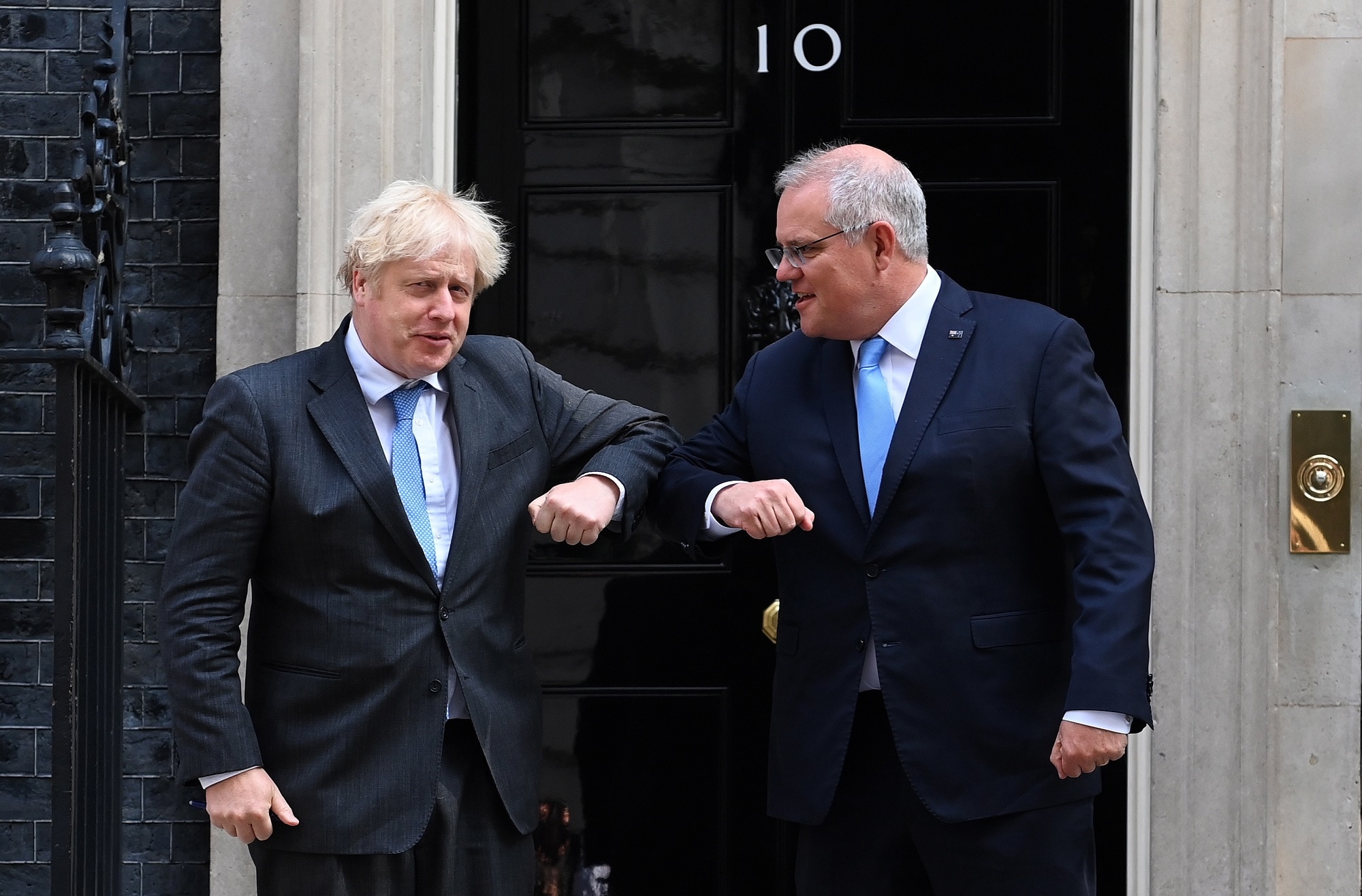 British Prime Minister Boris Johnson (L) welcomes Australian Prime Minister Scott Morrison to 10 Downing Street in London.