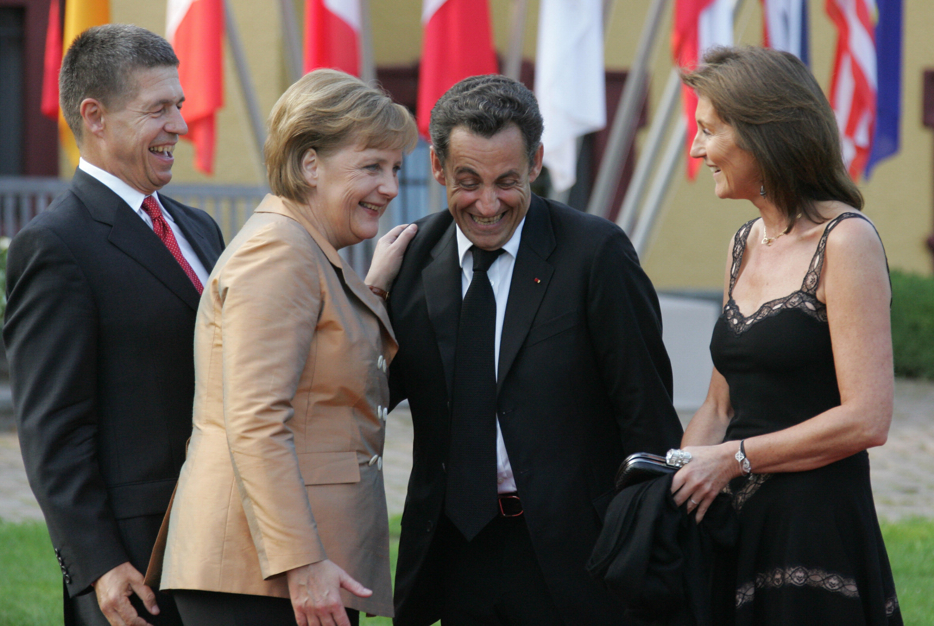 With her husband Joachim Sauer, left, and then-French president Nicolas Sarkozy and his wife Cecilia in 2007.