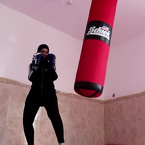 Bushra Abdel-Zahra working out in her home