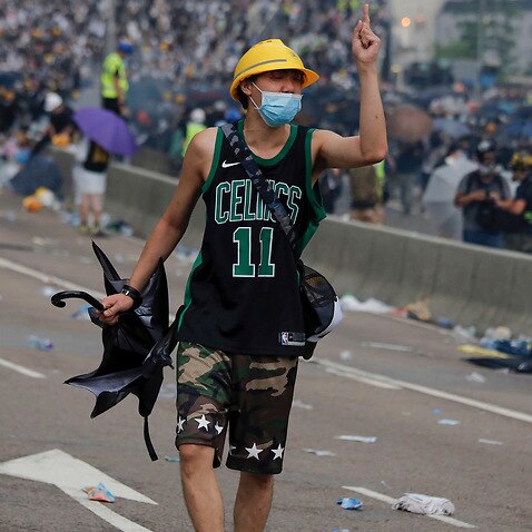 Hong Kong police fired tear gas and rubber bullets at protesters who had massed outside government headquarters on Wednesday.