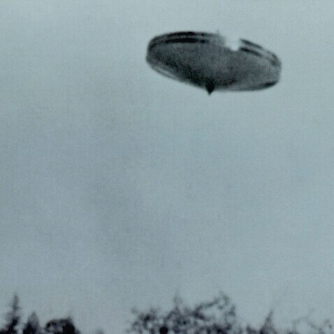 Contactee Daniel Fry, thanks  to his extraterrestrial  friends, was able to film this  spinning UFO over Merlin,  Oregon      Date: May 1964