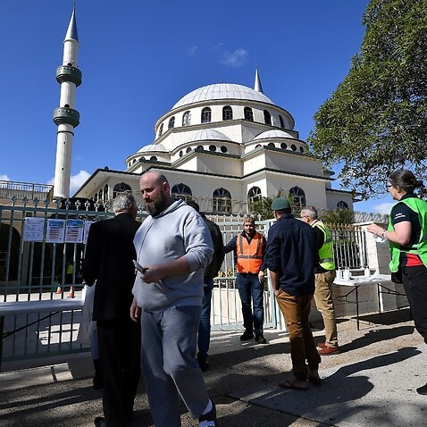 Muslim worshippers arrive at the Auburn Gallipoli Mosque for a mass Friday prayer on the first day of the Eid al-Adha festival in Sydney on July 31, 2020. 