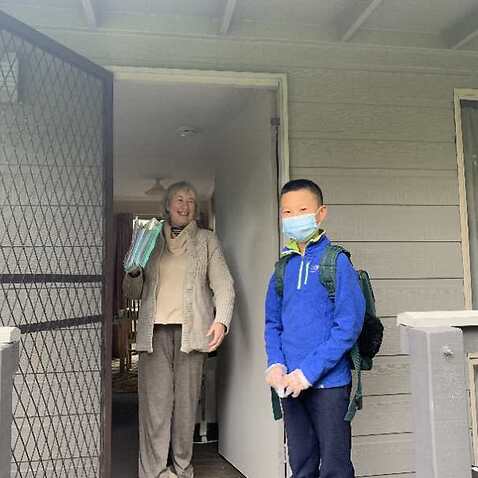 Jack Jiaji Lin and his neighbour who was given 10 free masks 