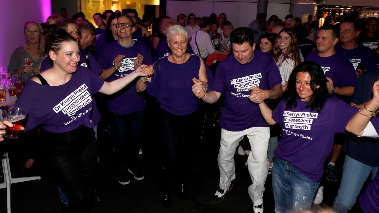 Independent candidate for Wentworth Kerryn Phelps (third left) dances after delivering her victory speech.