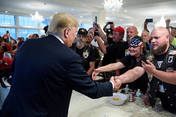 Mr Trump shakes hands and greets Bikers for Trump during the event.