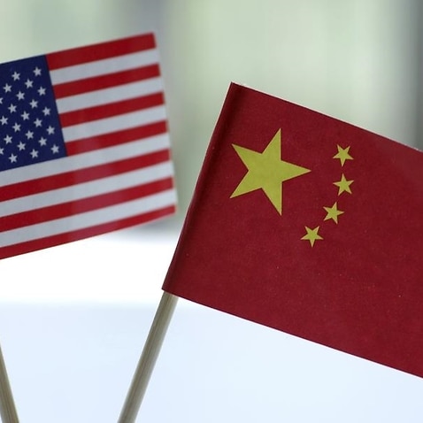 An image of the US and China flags