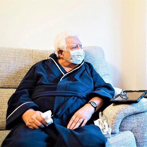 An elderly man in an aged care facility. 