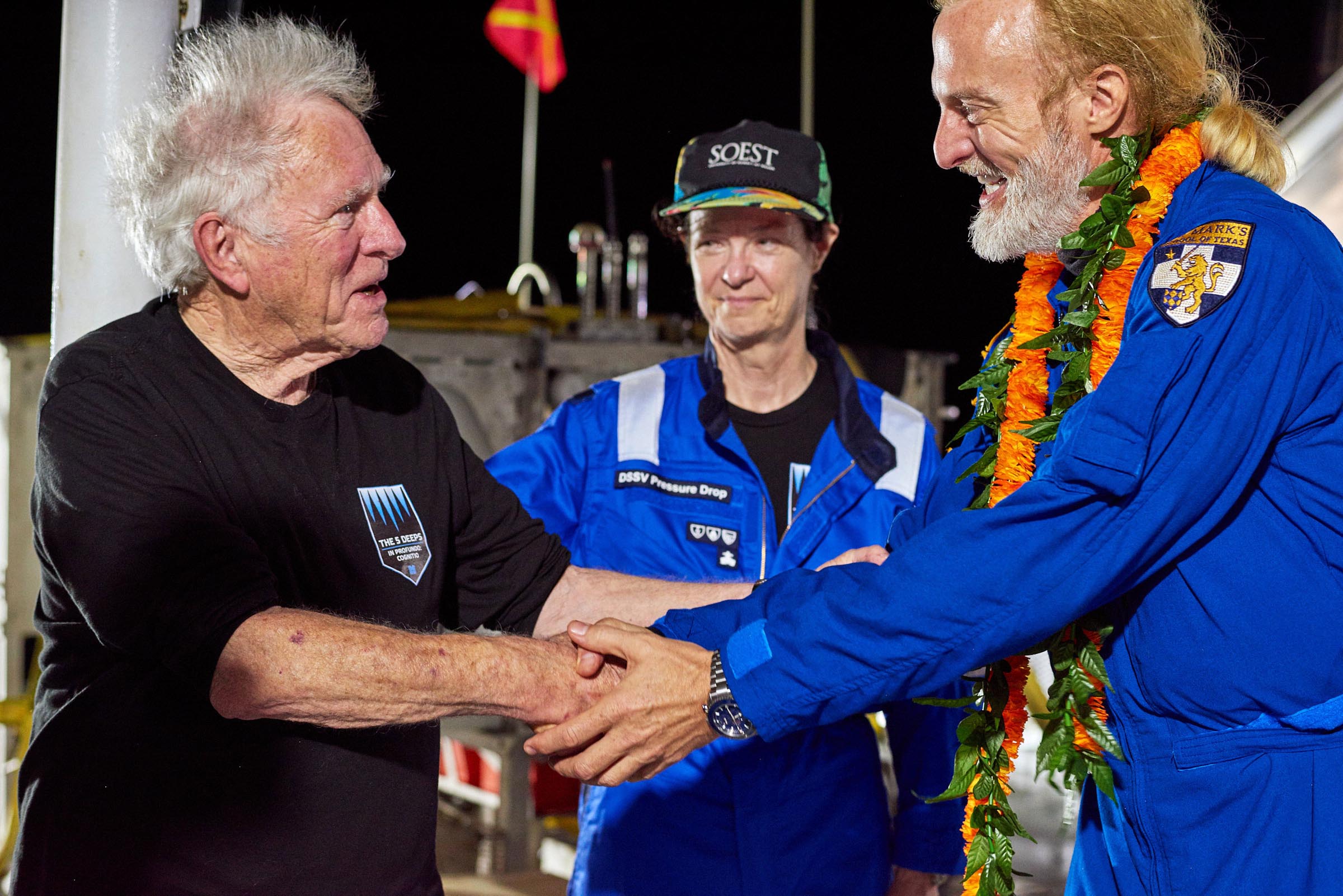 Don Walsh (left), who dived to the bottom of the Mariana Trench in 1960 with the US Navy, congratulates Victor Vescovo (right) on setting a new dive record.