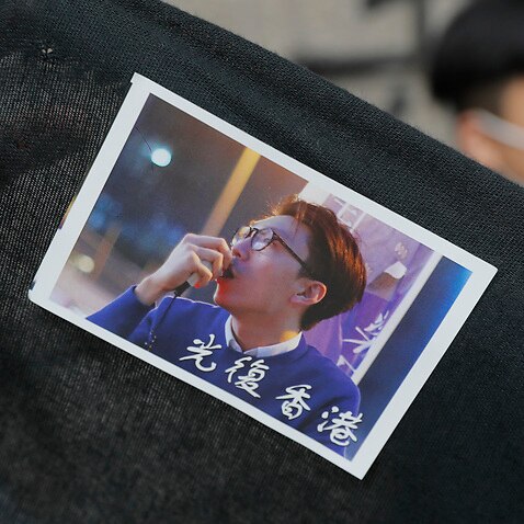 A sticker featuring a picture of Hong Kong activist Edward Leung with Chinese words which read 