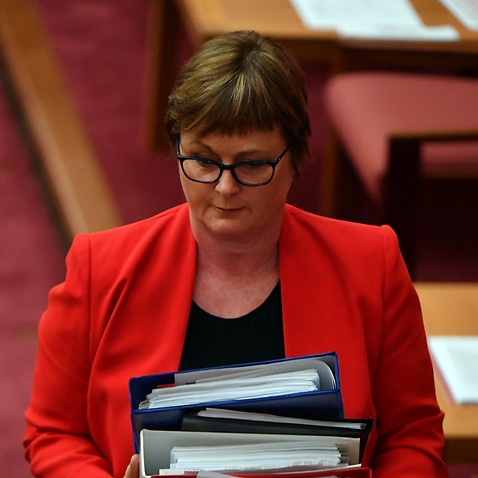 Minister for Defence Linda Reynolds leaves after Question Time in the Senate chamber at Parliament House.