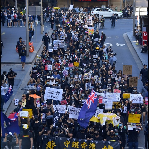Pro democracy supporters are seen during a Hong Kong pro-democracy demonstration in Sydney. AAP