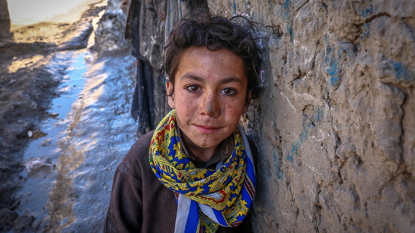 An Afghan boy from Kandahar province poses for a photograph at an Internally Displaced People (IDP) camp on the outskirt of Kabul, Afghanistan.