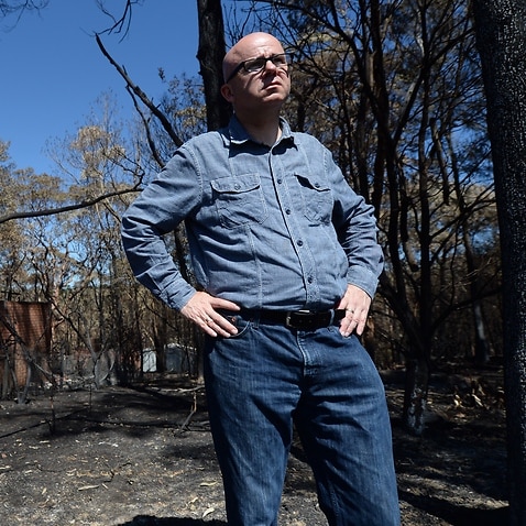 Blue Mountains Mayor Mark Greenhill poses for photographs in fire affected areas in the town of Winmalee in the Blue Mountains, west of Sydney, Wednesday, Oct. 23, 2013. (AAP Image/Lukas Coch) NO ARCHIVING