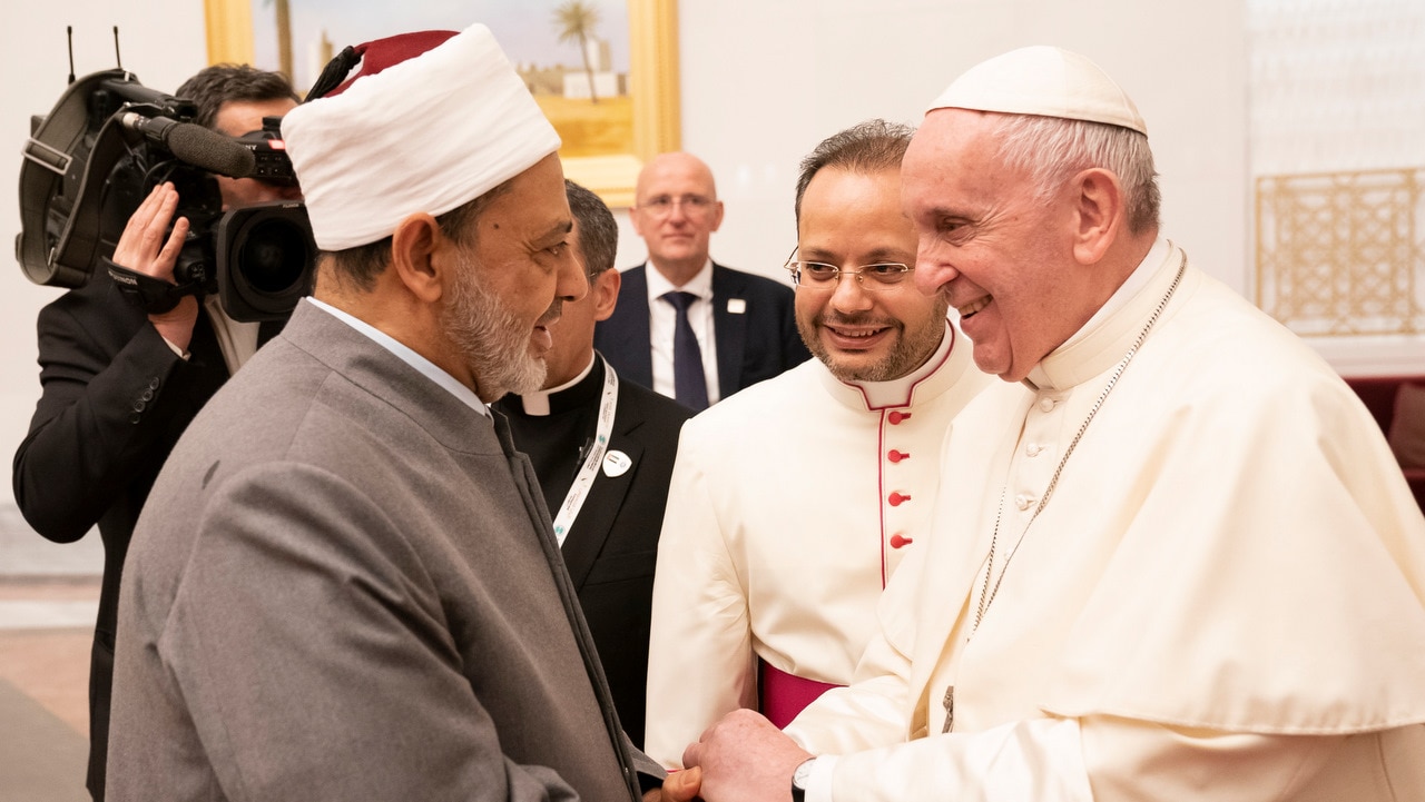 Pope Francis shakes hands with Grand Sheik Ahmed al-Tayeb, the head of Al-Azhar, the Sunni Muslim world's premier Islamic institution.