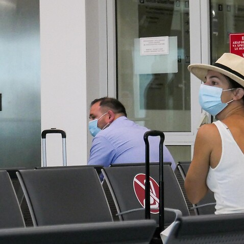 Passengers waiting with facemask at the Athens International airport