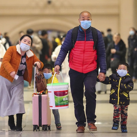 Travelers at Hankou Railway Station in Wuhan in southern China's Hubei province.