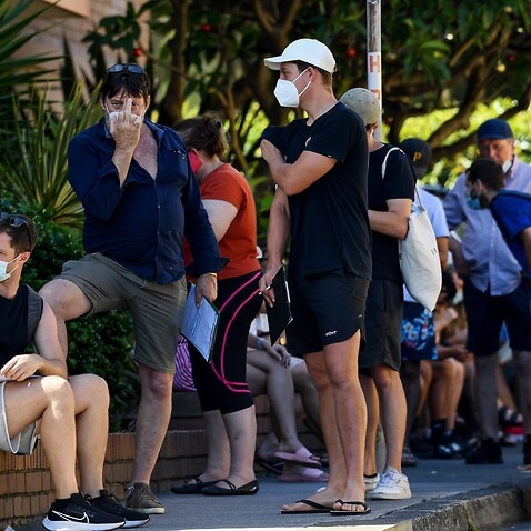 Members of the public queue for a COVID-19 PCR test at a doctors surgery in Sydney.