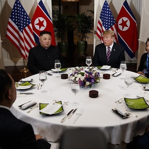President Donald Trump and North Korean leader Kim Jong Un at dinner
