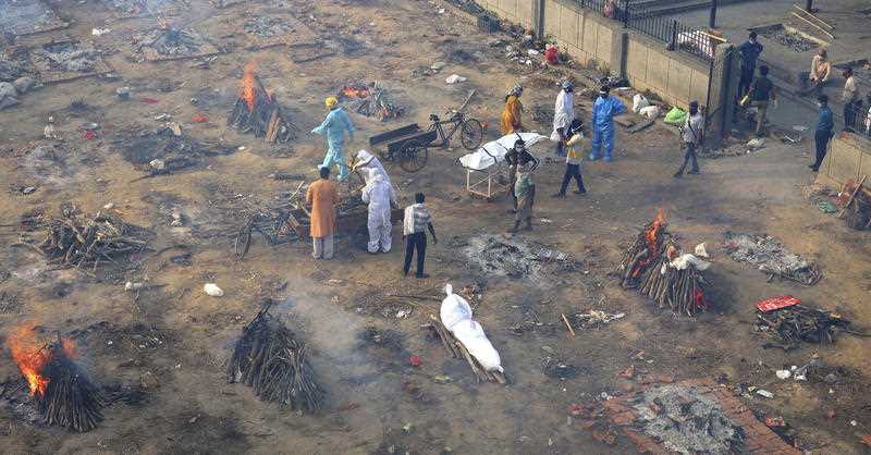 Multiple funeral pyres are seen in New Delhi for people who died of COVID-19 