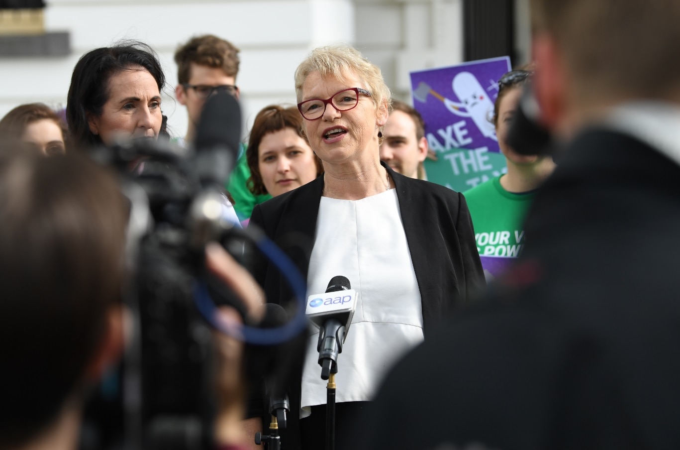 Victorian Greens Senator Janet Rice (centre) addresses the media outside of the Commonwealth Parliament Offices in Melbourne, Wednesday, October 3, 2018. 