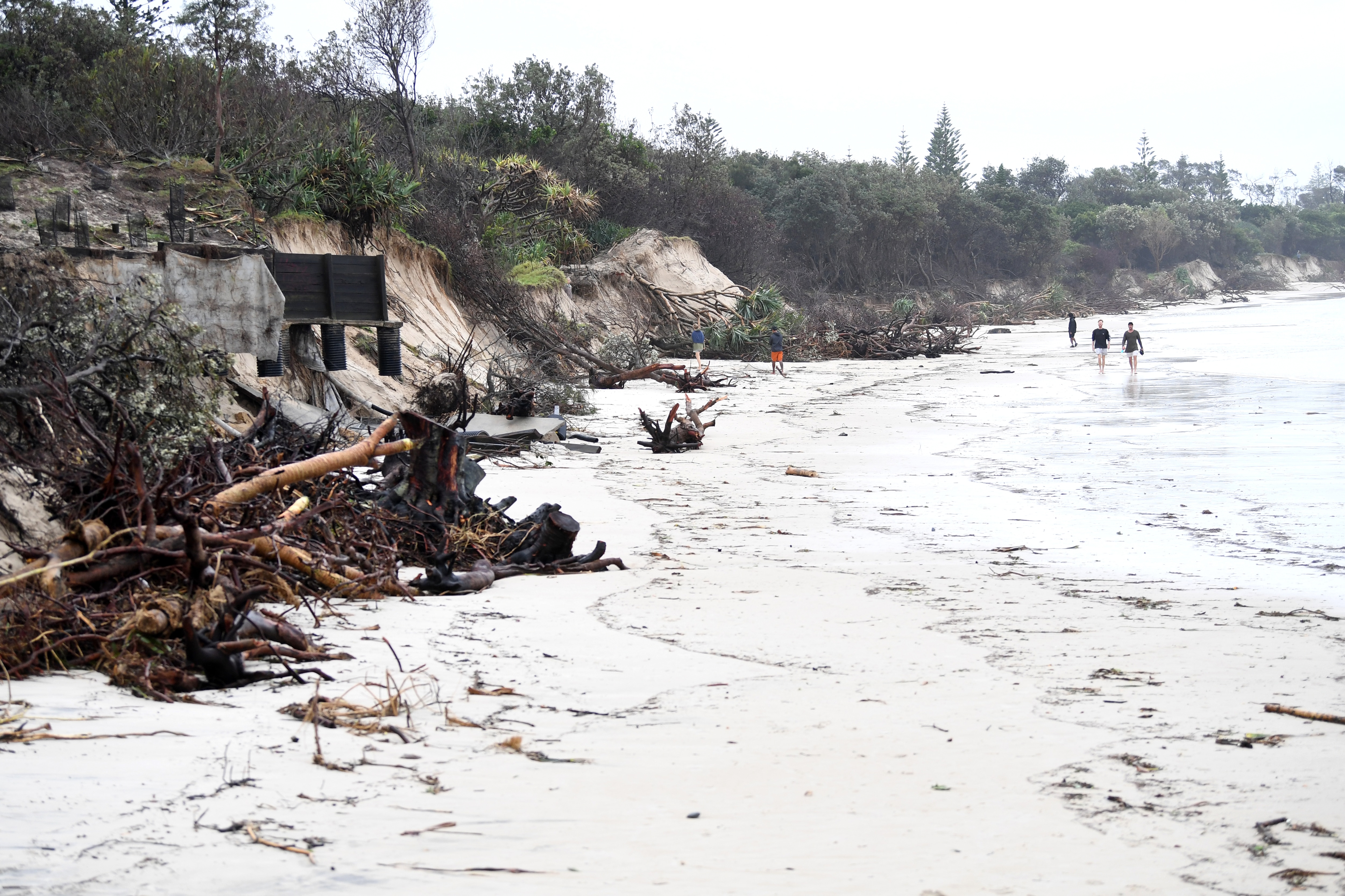 Locals inspect erosion damage to Clarkes Beach at Byron Bay, NSW, on 14 December, 2020. 