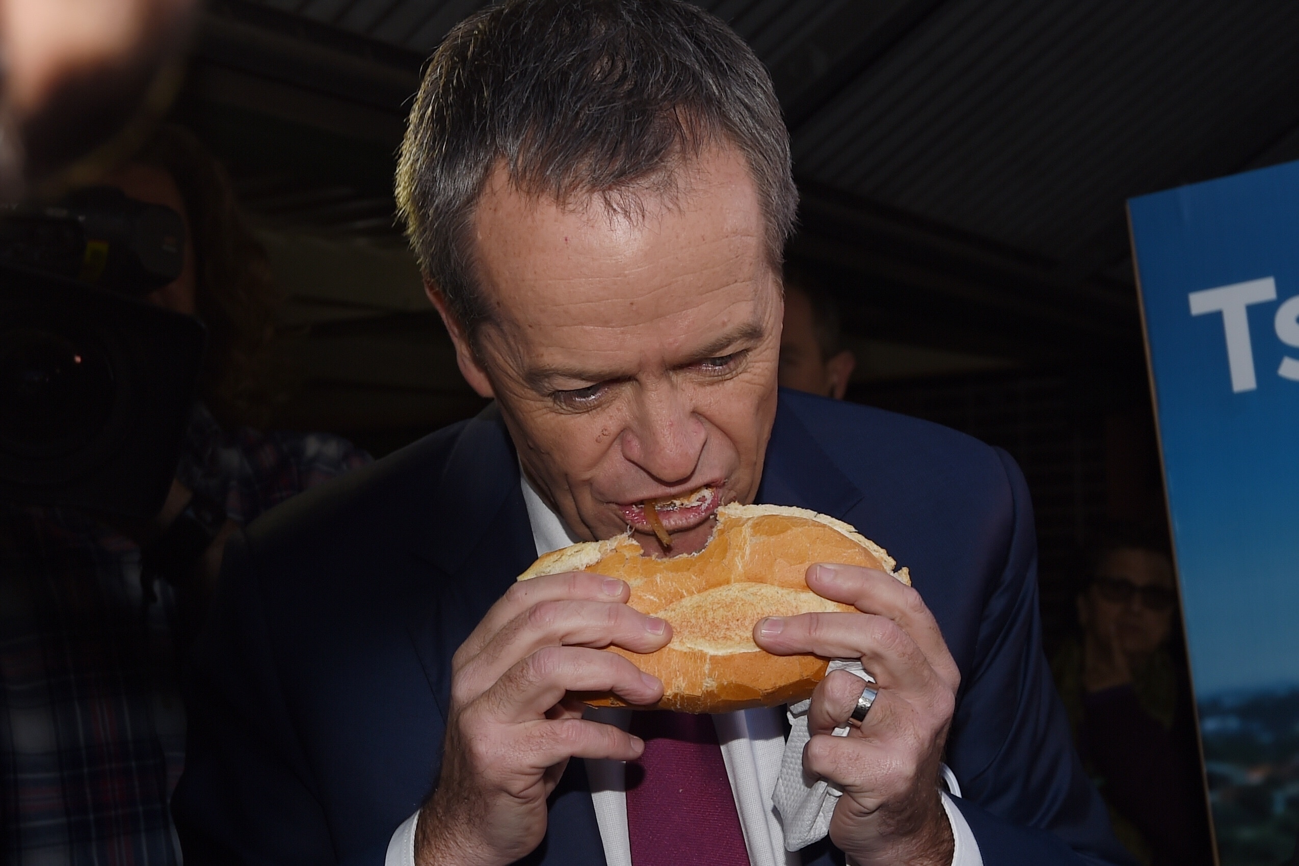 Then-Labor leader Bill Shorten eating a sausage in a roll at a Sydney polling booth on election day in 2016.