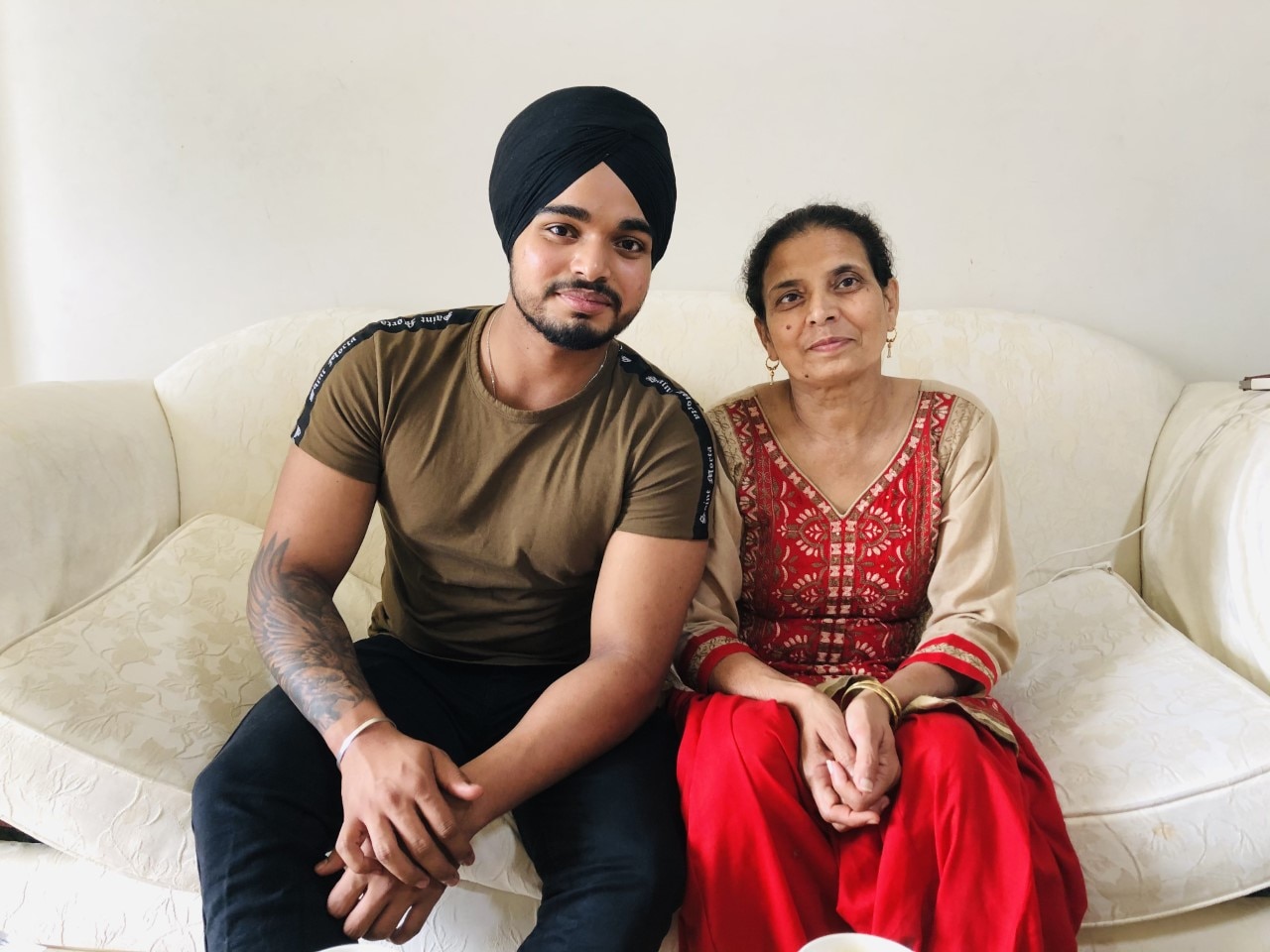 Paramjit Kaur with her nephew Gaganjot Singh at home in Western Sydney.