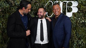  Adam Goodes, Director Daniel Gordon and Stan Grant pose on the red carpet at the world premiere of the documentary The Australian Dream in Melbourne.