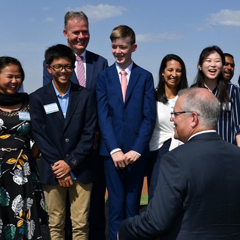 PM Scott Morrison with newly sworn in citizens at an Australia Day ceremony