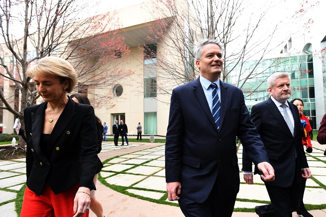 Ministers Michaelia Cash (left), Mathias Cormann (centre) and Mitch Fifield (right) have delivered a fatal blow to the PM's leadership. 