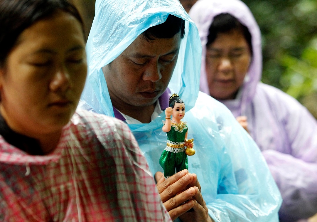 Relatives pray their missing children will be found safe.