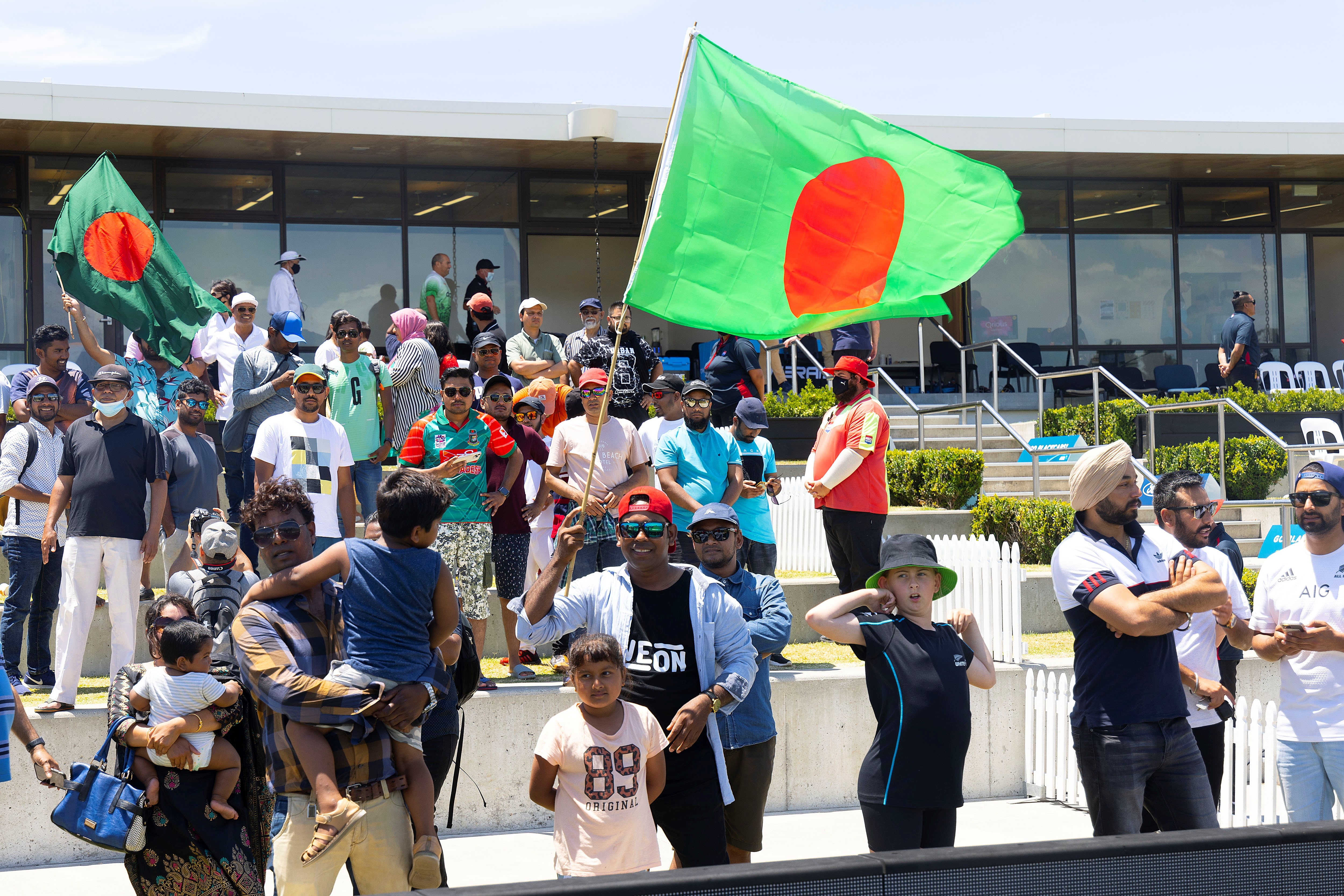 Bangladesh fans celebrate after the team won during play on day five of the first cricket test between Bangladesh and New Zealand at Bay Oval in Mount Maunganui, New Zealand, Wednesday, Jan. 5, 2022.
