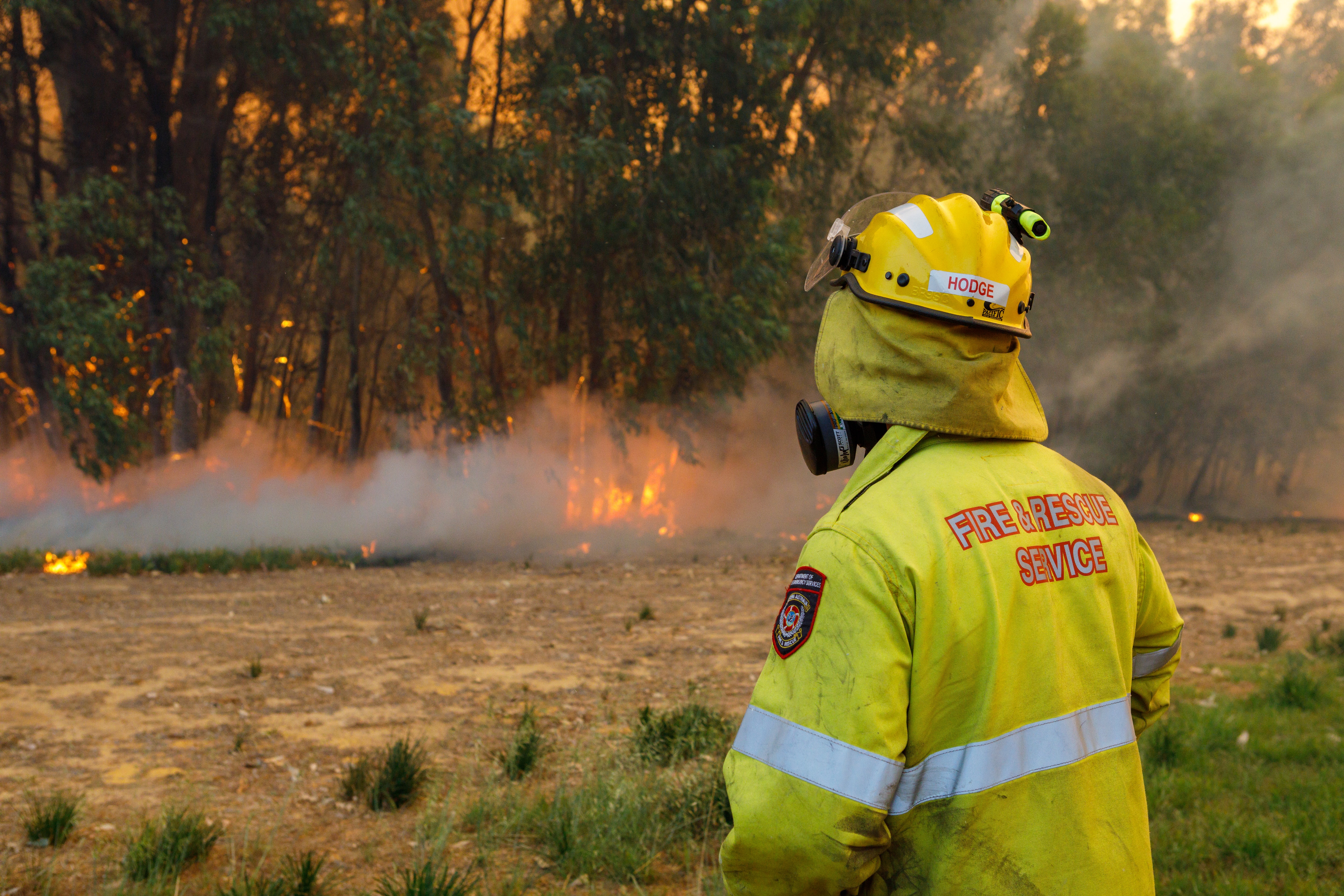Fire crews keep watch over a bushfire in Yanchep, Western Australia.
