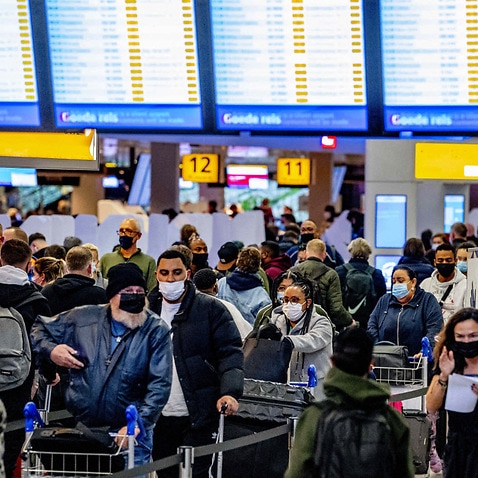 Crowds seen at Amsterdam's Schiphol airport on 30 November, 2021.