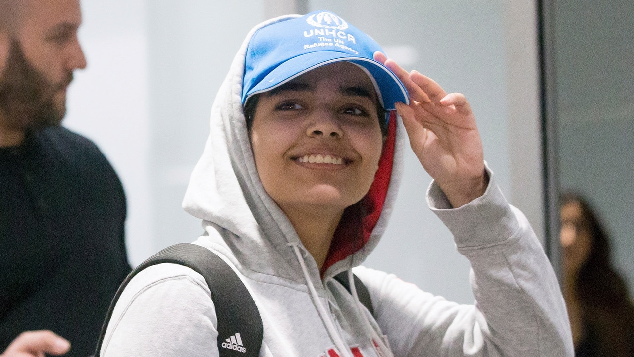 A happy looking Rahaf Mohammed al-Qunun, 18, arrives at Toronto Pearson International Airport.